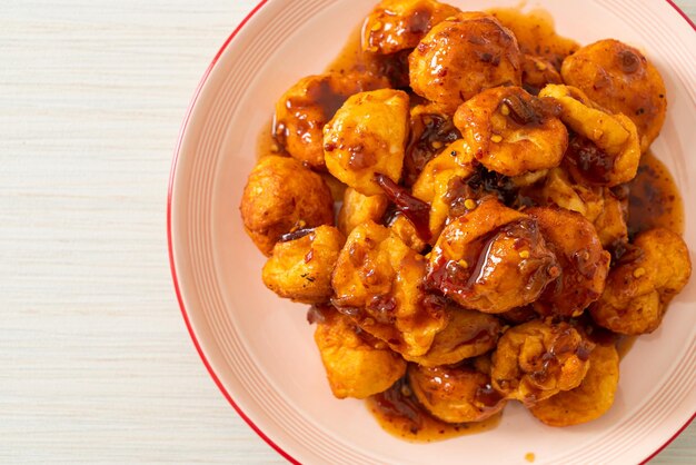 Fried meatballs with spicy dipping sauce