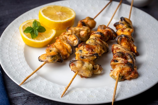 Fried mussels, delicious skewered mussels (Turkish name; midye tava, cöp sis midye)