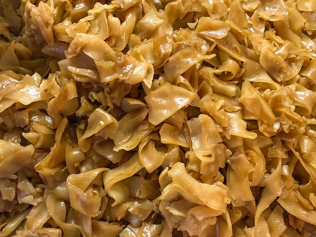 Fried noodle with soy bean sauce stack background.