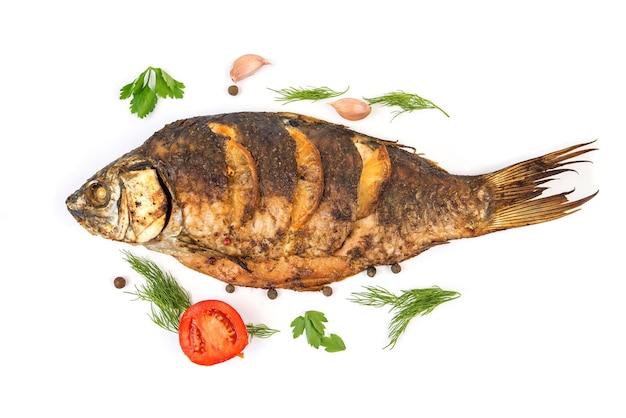 Fried or oven baked whole fish isolated on white background