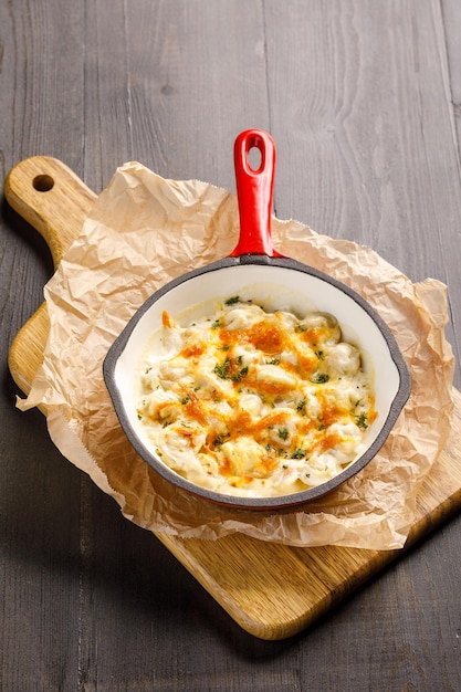 Fried pelmeni served in pan