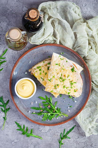 Fried pita bread with scrambled eggs tomatoes meat and cheese Stuffed lavash