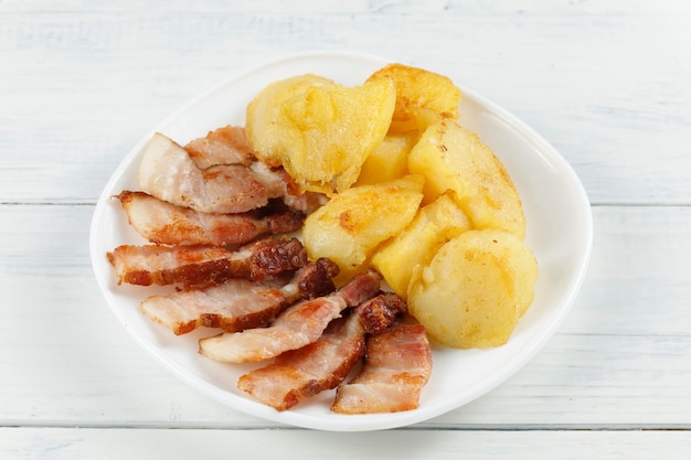 Fried potatoes and bacon Traditional food