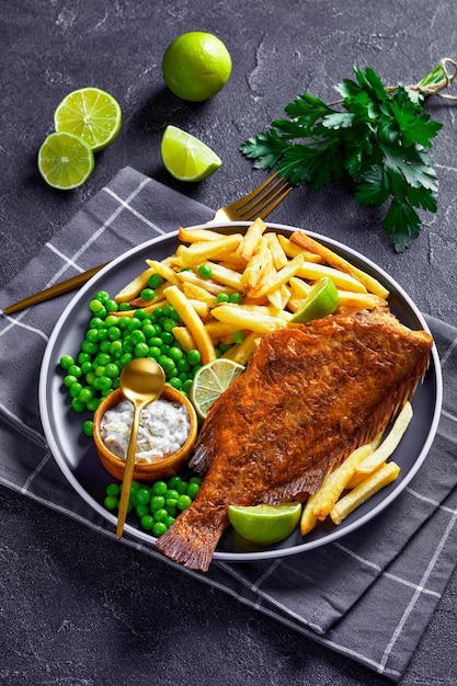 Fried redfish with chips green peas tartar sauce