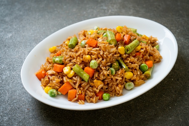 fried rice with green peas, carrot and corn - vegetarian and healthy food style