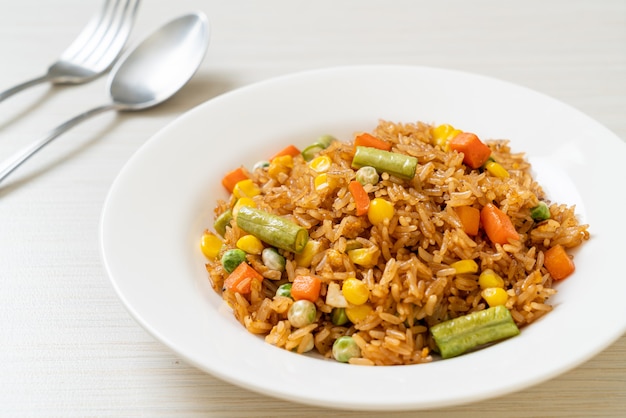 fried rice with green peas, carrot and corn - vegetarian and healthy food style