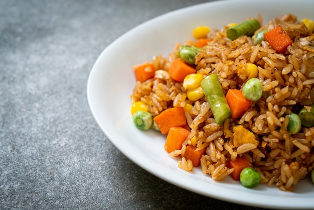 fried rice with green peas, carrot and corn - vegetarian and healthy food style