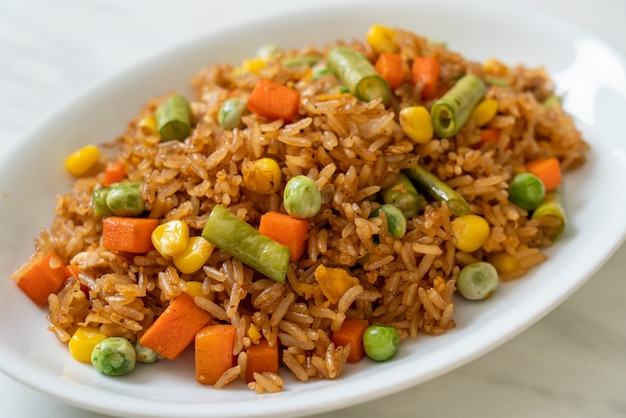 fried rice with green peas, carrot and corn - vegetarian and healthy food style