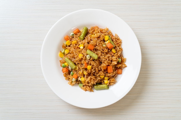 fried rice with green peas, carrot and corn - vegetarian and healthy food style