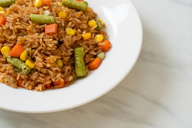 Fried rice with green peas carrot and corn  vegetarian and healthy food style