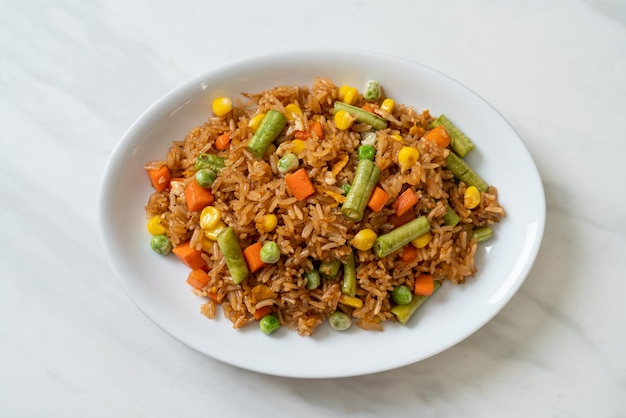 Fried rice with green peas carrot and corn