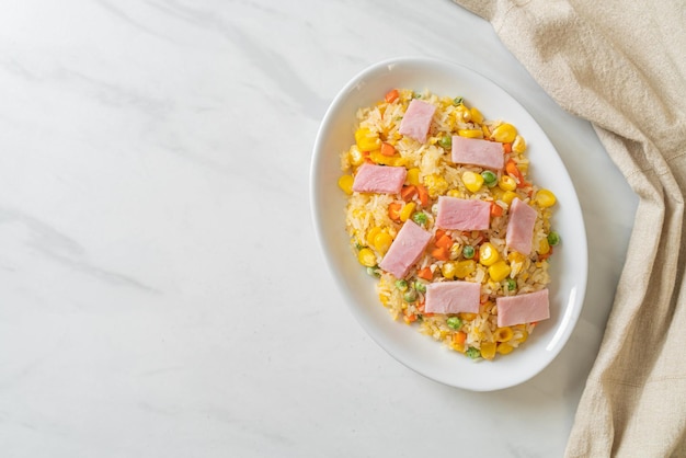 Fried rice with ham and mixed vegetable carrot green bean peas carrot