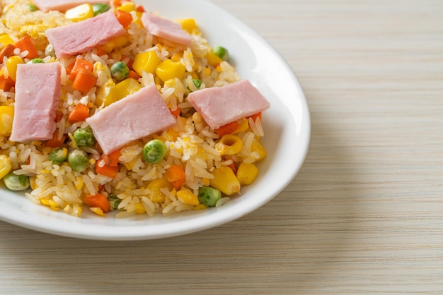 Fried rice with ham and mixed vegetable carrot green bean peas carrot