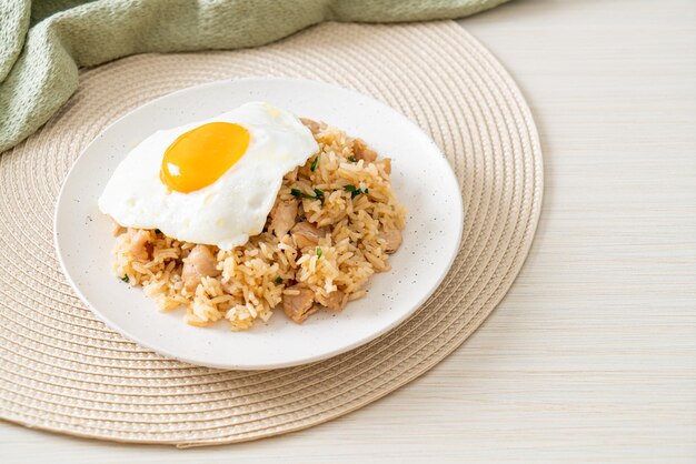 Fried rice with pork and fried egg in Japanese style