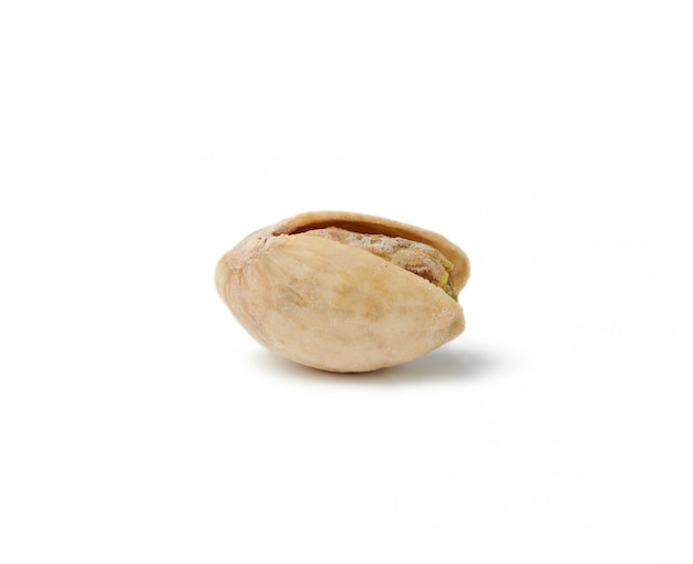 Fried salted pistachio isolated on a white background