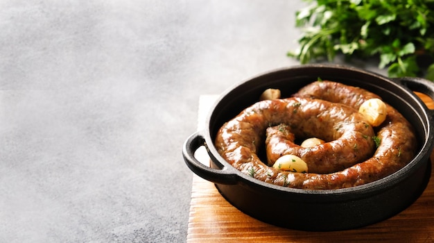 Fried sausage in a pan Copy space