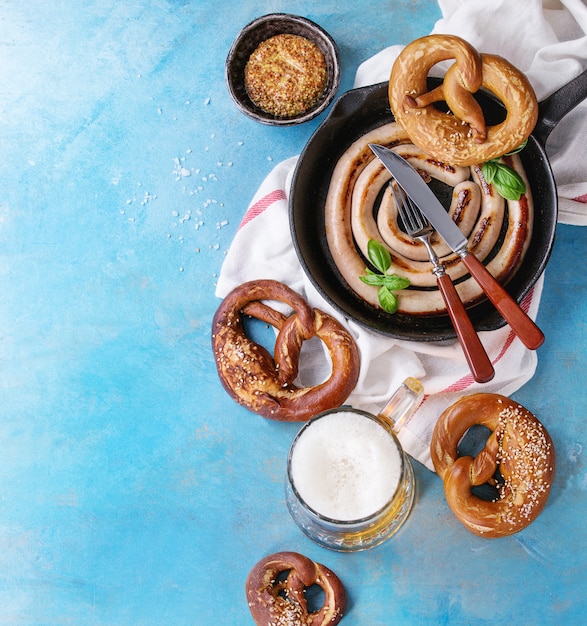 Fried sausage with beer and pretzels