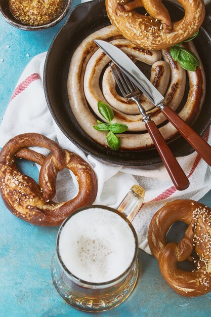 Fried sausage with beer and pretzels