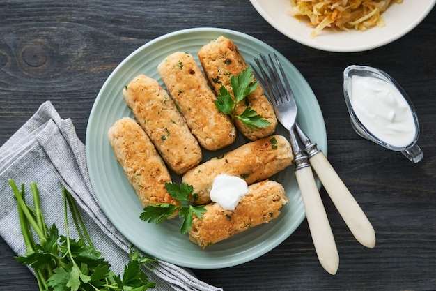 Fried sausages of boiled white beans on plate