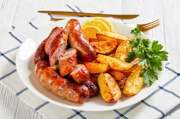 Fried sausages on a plate with potatoes