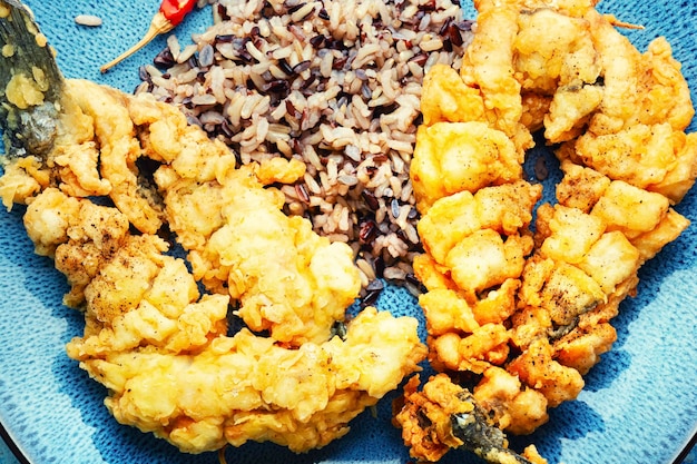 Fried sea bass with wild rice