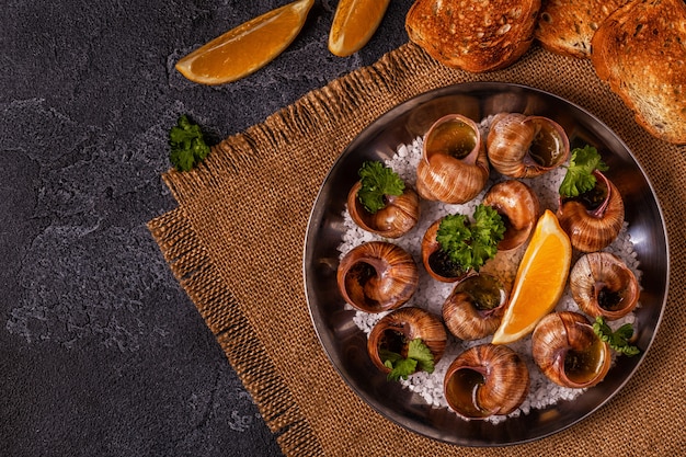 Fried snails with lemon and parsley