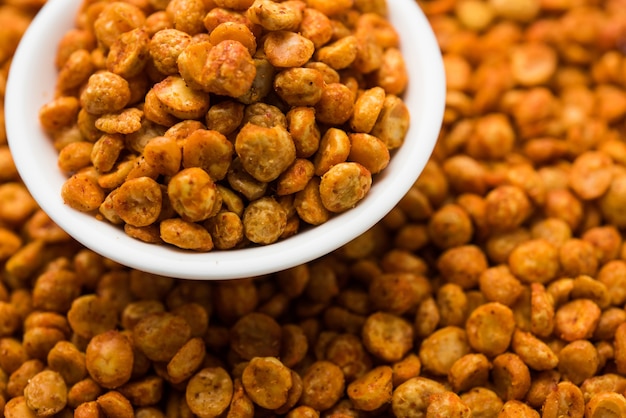 Fried and Spicy Chana Dal Masala is a popular Chakna recipe. served in a bowl. selective focus