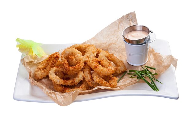 Fried squid rings with sauce On the Board and white background