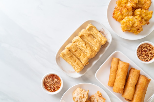 fried taro, corn, tofu and spring roll with sauce - vegan and vegetarian food style