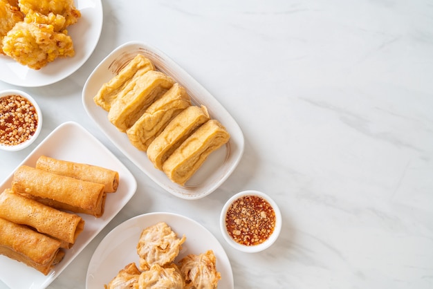 fried taro, corn, tofu and spring roll with sauce - vegan and vegetarian food style