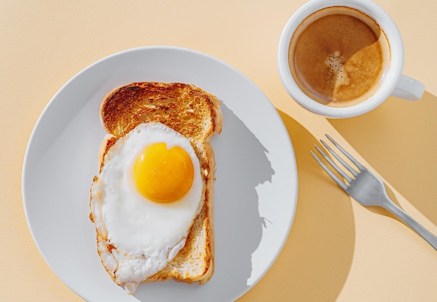 Fried Toast bread with four different types of cooked chicken eggs scrambled eggs fried eggs poached egg and creamed egg Breakfast of chicken eggs