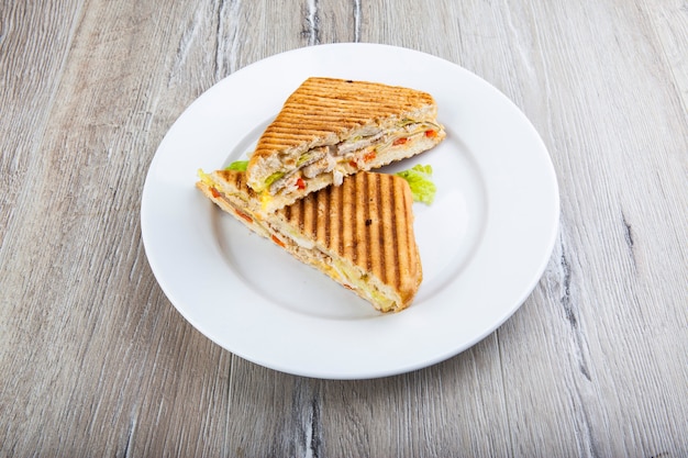 fried toast with meat filling on a white plate