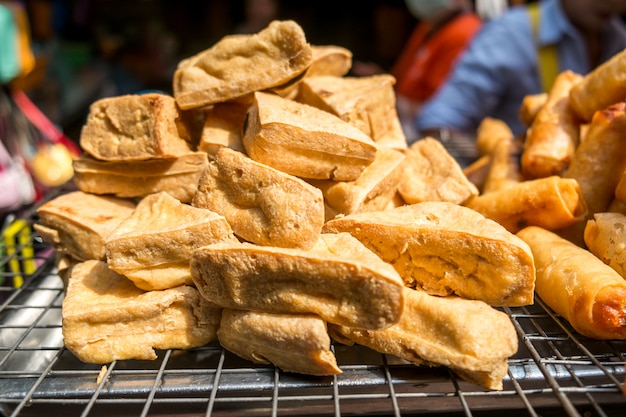 Fried tofu for sale at a local market in Bangkok, Thailand.