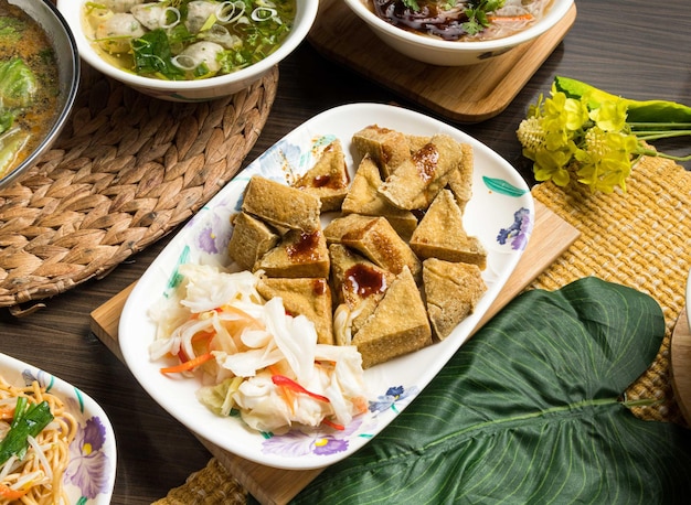 Fried tofu served in dish isolated on table side view of taiwan food