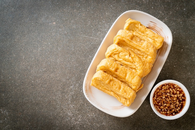 fried tofu with sauce - vegan and vegetarian food style