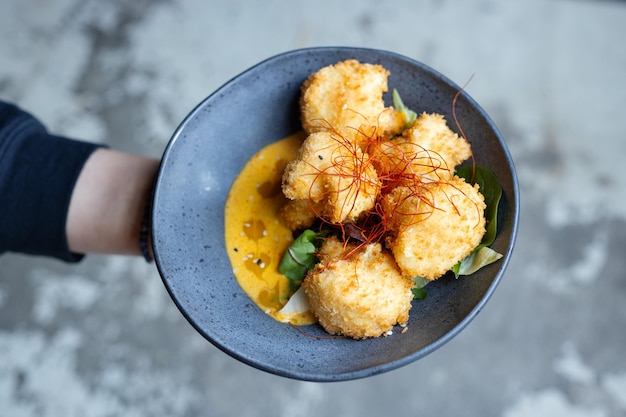 Fried vegetarian balls served in bowl