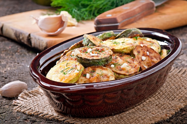 Fried zucchini in an old ceramic bowl