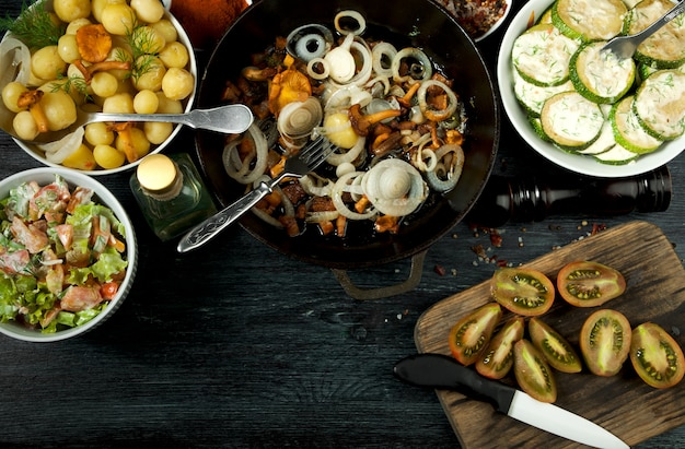 Fried zucchini, young boiled potatoes with dill and fried chanterelle mushrooms with golden onions