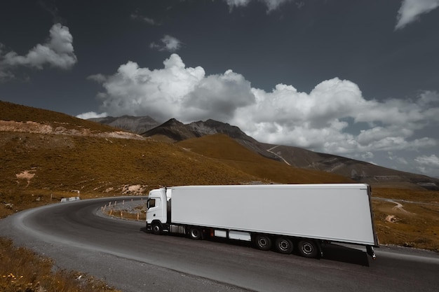 frieght truck driving through mountain road pass