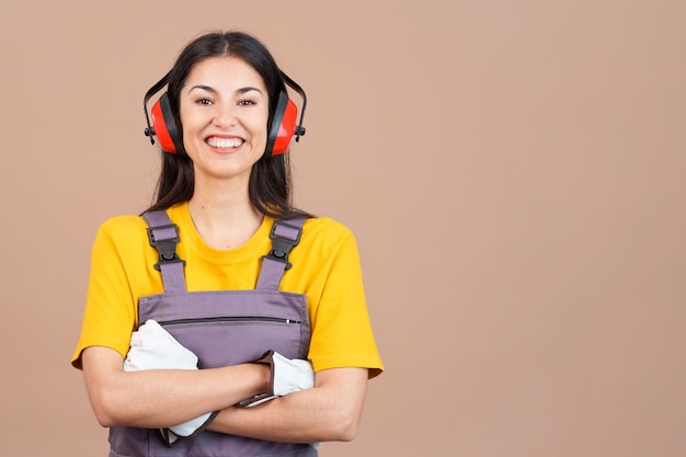 Friendly caucasian woman carpentry worker in work uniform