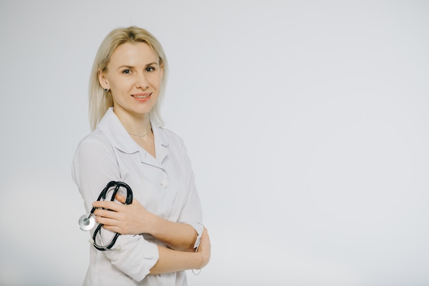 Friendly female doctor isolated over a white