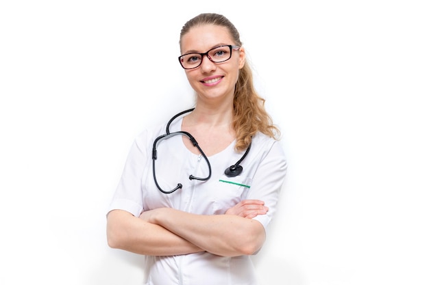 Friendly female doctor in white coat with phonendoscope isolated