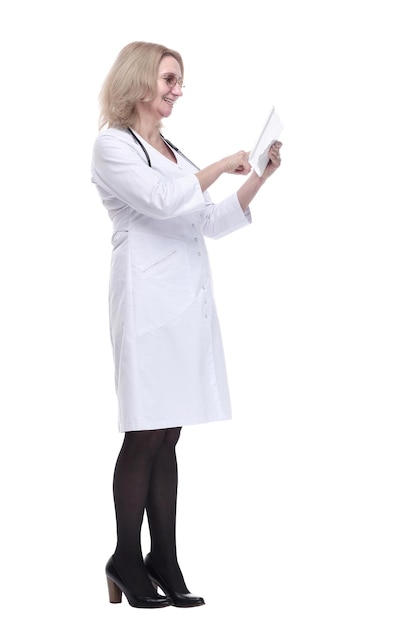 Friendly female doctor with a digital tablet looking at you