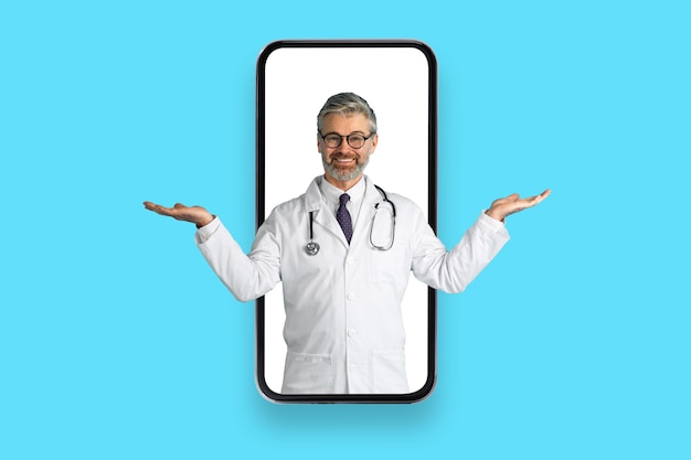 Friendly handsome mature doctor in cell phone screen