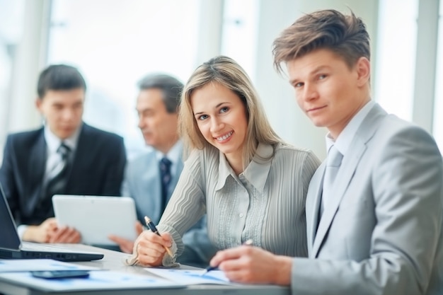 A friendly and successful business team in a workplace in a modern office