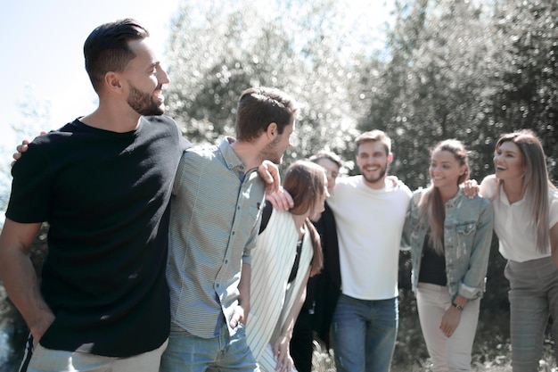 Friendly team of young people on the background of the city Park