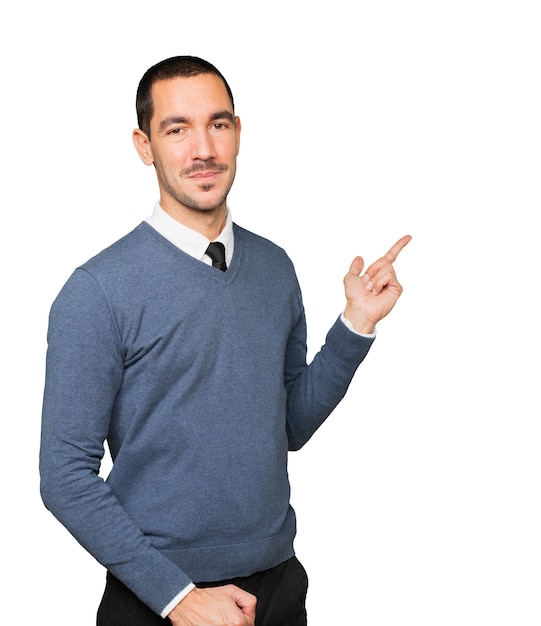 Friendly young man making a gesture of welcome