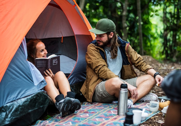 Friends camping in the forest together