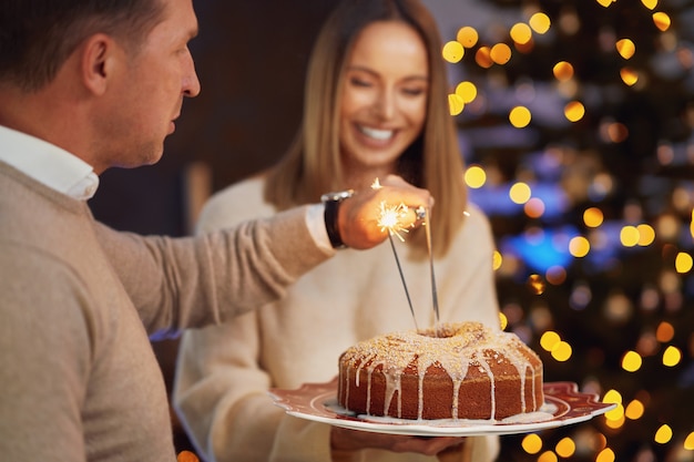 Friends celebrating christmas party holding wine. High quality photo