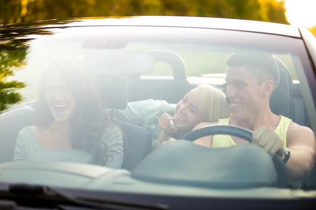 Friends in a convertible car